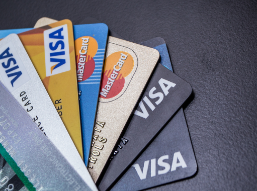 A stack of credit cards that are being used to illustrate the difference between bad credit and no credit scores