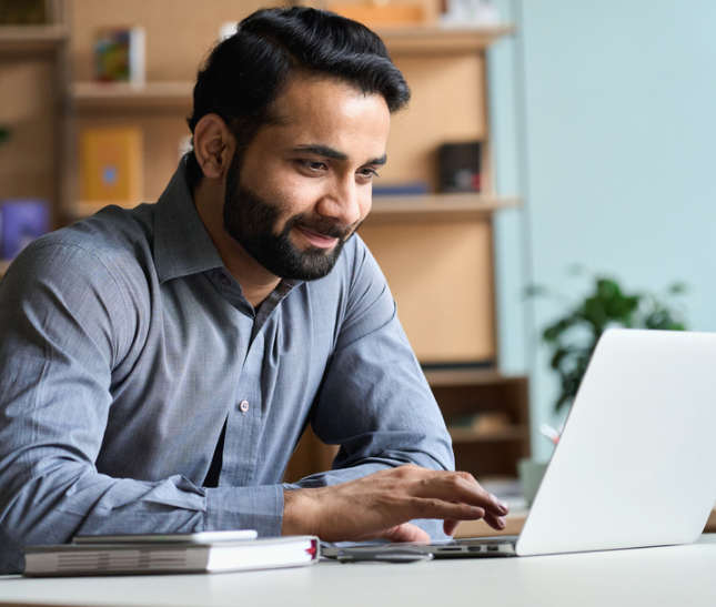 A man on a computer exploring a personal line of credit