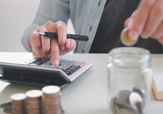 A person calculating payments for their personal installment loans