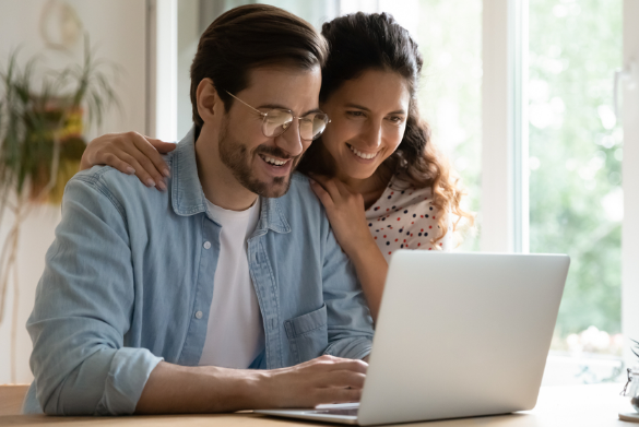 A couple researching quick loans for bad credit from their couch