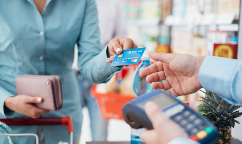 Person paying a bill with a credit card