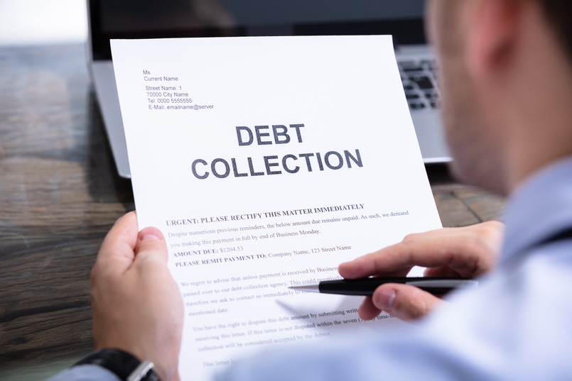 Man reading debt collection letter