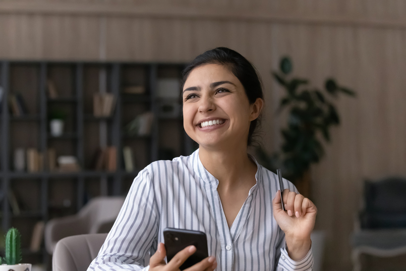a young woman excited about being approved for a personal loan