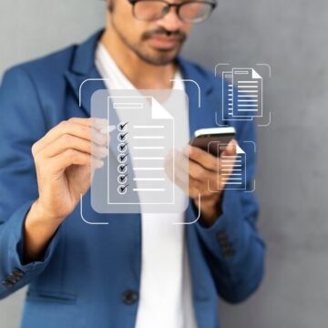 Man on a phone with a checklist in the foreground