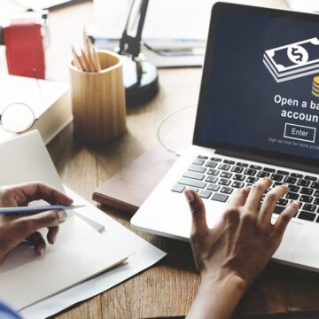 Open a bank account screen displayed on a laptop