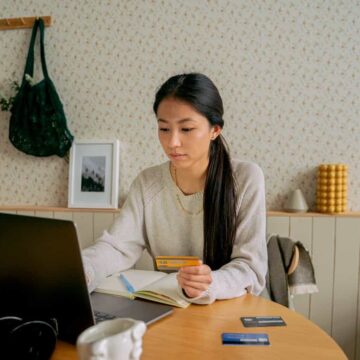 Woman exploring her cash advance loan options on a laptop.