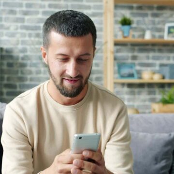 Man using phone to get a same day loan