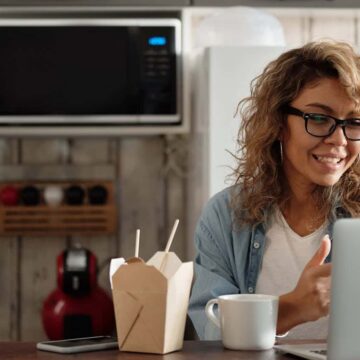 Woman looking at loans on computer